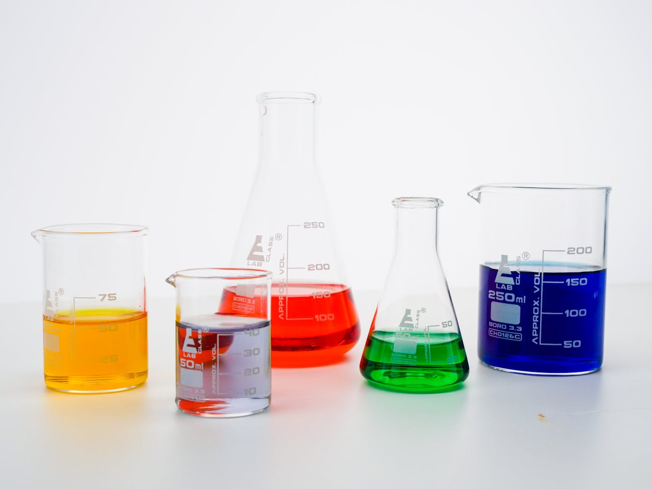 Various colored liquids in laboratory beakers highlighting scientific research.